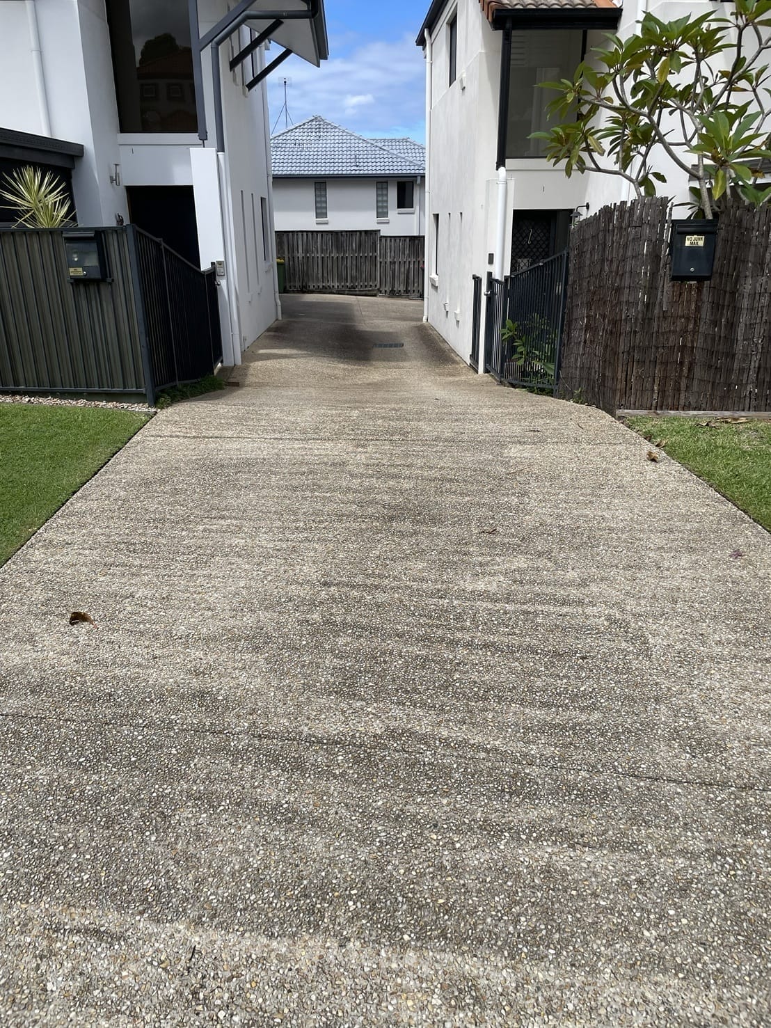 Exposed aggregate driveway before pressure cleaning